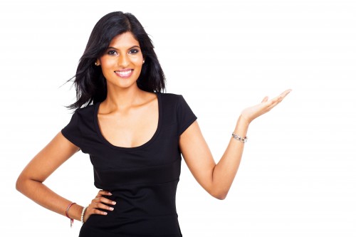 smiling indian businesswoman presenting on white background