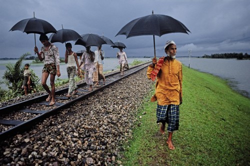 Built to remain above the annual inundation. The tracks are often occupied by entire villages, camping till the floods subside, Bangladesh, 1983National Geographic, June 1984, By Rail Across the Indian Subcontinent, Phaidon, The Unguarded Moment, Iconic Images, final book_iconic, final print_milan